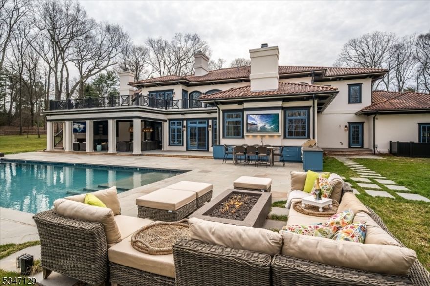 Welcome to this extraordinary custom retreat in the desirable New Vernon section of Harding Township. Situated down a gated private drive, this impressive estate blends timeless elegance and modern amenities and a newly-completed backyard oasis for luxurious resort-like living. A grand two-story entrance reveals exquisite millwork, architectural sophistication and quality construction throughout. The living room has high ceilings, French doors, oversized windows and stately fireplace, while the dining room offers more formal entertaining space. The gourmet kitchen boasts a large center island, professional appliances, large pantry and spacious breakfast area. The adjoining family room has gas fireplace, oversized windows and doors to the sunroom and patio. A first floor primary wing features a large bedroom with fireplace, dual closets, luxurious bath and sitting room. Two home offices and four additional bedrooms provide ample space and privacy. The private backyard is an entertainer's dream with an expansive bluestone patio, covered dining and living areas and full outdoor kitchen. A massive outdoor fireplace, large screen TVs, retractable screens, and radiant and overhead heating ensure-year round enjoyment. The large heated pool is the perfect place to unwind. Whole house generator, upgraded electrical and smart home system provides peace of mind. All in a convenient yet private location with easy access to nearby downtowns and transport to NYC. List of updates available.