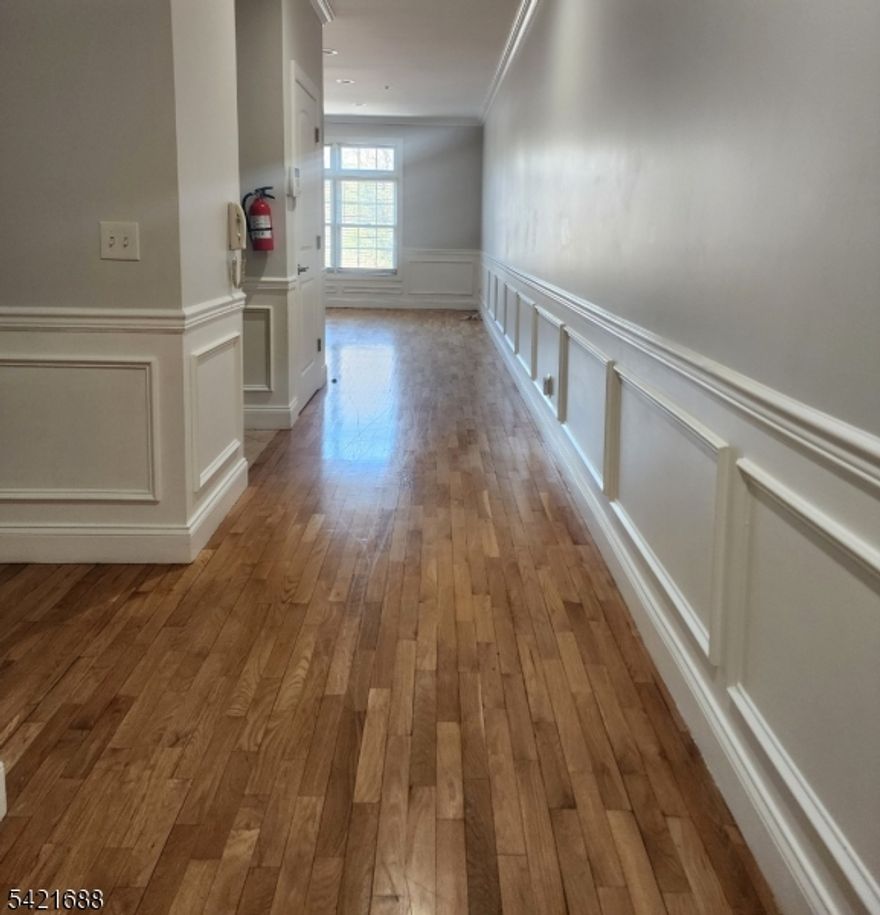 Meticulously maintained 2 bedroom, 1.5 bath condo located in sought after Springfield Commons in Maplewood! Welcome to one floor living. Beautiful hardwood floors throughout. Spacious living/dining room combo with tons of natural sunlight. Kitchen features granite counters, tiled backsplash, stainless steel appliances, large breakfast bar and pantry. Oversized master bedroom with walk in closet. Private deck to relax off of both bedrooms. Tons of closets, washer and dryer in unit, central air and one assigned garage parking spot. Fantastic location that's centrally located. Walking distance to public transportation, highway, shopping, restaurants and across the street from Maplecrest Park. Secure building. No smoking.