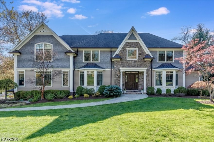 Stunning 7 bed, 6.1 bath home located in one of Short Hills' most picturesque neighborhoods. Built in 2012, this home is filled with custom touches, including upgraded lighting, designer wall coverings, and more. The first floor features a grand foyer, elegant dining room, butler's pantry, gourmet eat-in kitchen with center island and high-end appliances open to a generous family room, tranquil living room, conservatory (can be used as 2nd office or playroom) and powder room. A convenient back wing with 2 pantries, mud room and office/guest room with full bath completes the first floor. The upstairs living quarters can be accessed either by the front or back staircase. There are 5 spacious bedrooms and 4 baths (3 ensuite), all with generous walk-in closets, including a large and well appointed primary suite with luxurious marble bath. There is also a bonus common room/play area on the second floor. The third floor is partially finished, easily built-out and offers endless storage. A huge walk-out basement with a bedroom, full bath, gym and rec room is perfect for entertaining and every day play. There is a large deck off of the kitchen/family room and the house sits on a flat .5 acres with a 3 car garage. Generator, underground sprinklers, security system, gleaming hardwood floors. It is an ideal setting to host family and guests, both inside and out.