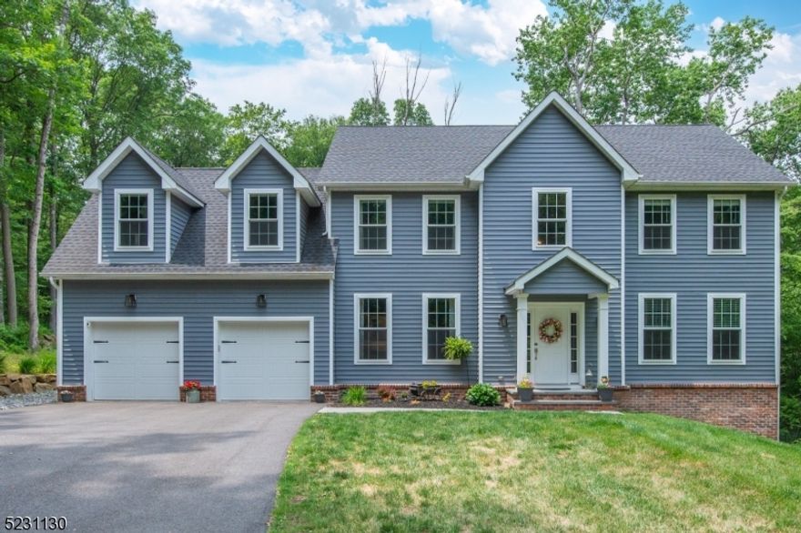 SUN 7/30 OPEN CANCELLED; Better than new, this home is PERFECT!  Just 5 years young, this home features privacy, open floor plan, hardwood flooring on the main level, finishable walk-out basement with high ceilings, recessed lighting, composite deck, 2 patios, built-in fire pit, professional landscape, low maintenance vinyl and brick exterior, 2 HVAC units and pull down stairs to attic storage. Minutes to shopping, theaters, dining.  Two story foyer leads to light, bright and neutral living spaces, including formal living and dining rooms, amazing chef's delight white kitchen with quartz countertops, center island, stainless steel farm sink &appliances, wine refrigerator and large breakfast area.  Family room features gas fireplace.  Second level offers convenient laundry room, 3 spacious bedrooms, main modern bath and primary ensuite with tray ceiling, walk-in closet and luxurious bath with rain shower.  Floorplan available.  Hackettstown mailing address 07840.