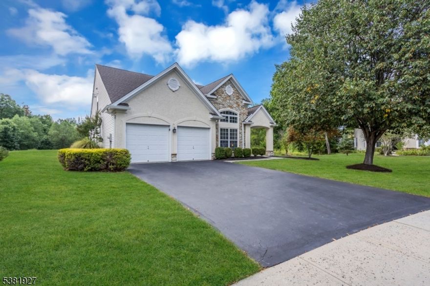 Welcome to this stunning Lincoln Manor model in Wellington Manor, a 55+ Community. This beautifully maintained stone & stucco home sits on a private, cul-de-sac lot and is loaded with upgrades. The gourmet eat-in kitchen features freshly painted 42" maple cabinets, granite countertops, stainless steel appliances, tile backsplash, and solar tube lighting. The two-story great room impresses with vaulted ceilings and a floor-to-ceiling stone fireplace, while the formal dining and living rooms add elegance with crown molding and a Palladian window. The first-floor primary suite offers a tray ceiling, sitting area, walk-in closet, and spa-like bath with soaking tub & separate shower. Upstairs includes a private guest bedroom with full bath, spacious loft (currently used as a bedroom), and large storage closet.  All new flooring on first floor.  New stair runners and wall-to-wall carpeting on second floor.   Brand new roof in 2025. New 220 amp electric in garage for EV charging. Enjoy the paver patio with motorized awning and private backyard views. Recent updates include a newer HVAC, hot water heater, updated baths, custom blinds, and upgraded recessed lighting. Community amenities: clubhouse, pool, fitness center, tennis & bocce courts. Conveniently located near Princeton, Pennington, Bucks County, and major routes to NYC & Philly.