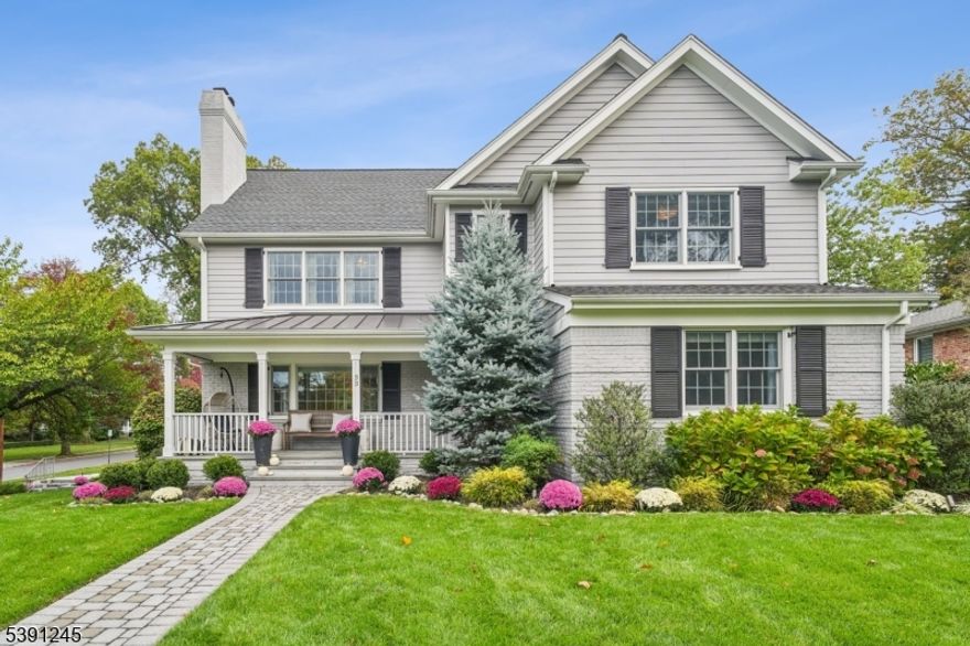 Perched on a corner lot in one of Summit's most sought-after neighborhoods, this extensively renovated Colonial perfectly blends luxury and functionality. With exceptional curb appeal, this home makes a lasting first impression. Step onto the inviting front porch and into a light-filled, open-concept layout designed for modern living. The formal living room features a gas fireplace and custom built-ins, seamlessly flowing into the elegant dining area. The chef's kitchen boasts quartz countertops, high-end appliances and a spacious center island. A versatile office/library provides a quiet retreat or flexible space to suit your needs. The first floor also includes a stylish mudroom, well-appointed bedroom and a full bath. Upstairs, the luxurious primary en suite is a true show stopper featuring a spa-like bath with soaking tub and oversized shower. There is plenty of storage in the walk-in closet. Three additional bedrooms, a full hall bath, and a convenient laundry room complete the second level. The finished basement has a recreation room, gym, custom cabinet storage and access to the attached 2 car garage. Enjoy outdoor living in the private, fenced-in, level yard ideal for gatherings and play. This is a completely turn-key opportunity just move in and enjoy everything this exceptional home and neighborhood have to offer.