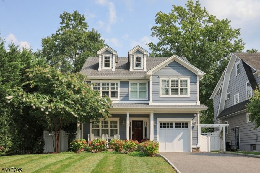 Located in the Blue-Ribbon Award-Winning Washington School District, this immaculate Colonial was built in 2016 from the ground up. Featuring a flexible floor plan, custom plantation shutters, lofty ceilings, hardwood floors & custom woodworking throughout, this home is sure to impress.  An open front porch invites you to this lovely home.  Once inside, the 1st floor enjoys a formal living room & FDR w/bay window, custom woodworking, tray ceiling & designer grass cloth wallpaper.  The family room boasts a coffered ceiling w/recessed lighting & gas FP flanked by built-in shelving. The family room is open to the EIK featuring a center island breakfast bar, granite countertops, SS appliances, double sink, & separate breakfast area. A convenient mudroom & powder room with marble vanity complete the first floor.  The 2nd floor is home to the primary bedroom suite w/WIC & private bath w/dual sink marble vanity, soaking tub, & marble shower. This floor also includes 3 addl well-appointed bedrooms, one with an oversized WIC, & guest bathroom w/double vanity.  A convenient 2nd floor laundry room round out this level.  The 3rd floor enjoys a large flex room incl a full bath.  Outside the grounds incl custom landscaping, a fenced backyard w/patio & attached one-car garage w/storage system.  Located on the North Side of Westfield, this home is conveniently located to parks, playground, library, & award-winning downtown Westfield for shopping, dining & NYC transportation.