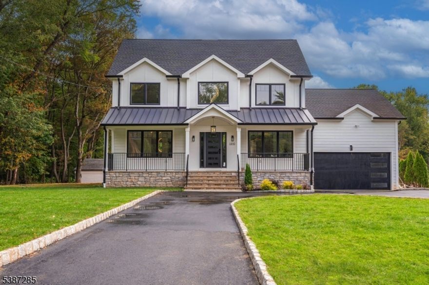 Welcome to this stunning, fully renovated Colonial, completed in 2025, offering over 4,900 square feet of beautifully designed living space. The main level is thoughtfully laid out with a bright and airy living room, elegant dining room, a gourmet kitchen with wine fridge fully prepped for hosting, and a spacious family room anchored by a sleek electric fireplace. This level also features a versatile bedroom with a full bath, an additional bedroom, a stylish half bath, a custom glass wine cellar, and a mudroom with plenty of storage to keep everything organized. Upstairs, retreat to the luxurious master suite with a spa-like bathroom, while three additional bedrooms and two full bathrooms provide even more space for residents. A dedicated laundry room adds extra convenience to daily living. The finished basement expands your options with a cozy den and another full bathroom, perfect for movie nights, a home gym, or guest space. Outside you'll enjoy a 490 sq. ft. Trex deck overlooking the backyard ready for entertaining or relaxing. The exterior boasts durable Hardie siding, an EV charging station, and a built-in shed for extra functionality.