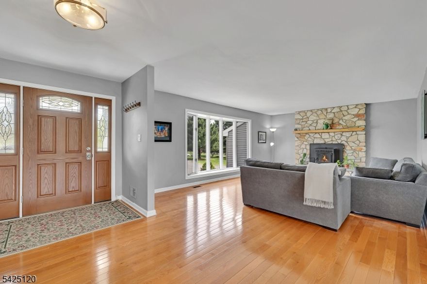 This spacious ranch has been thoughtfully updated over the past several years, creating a home with both comfort and style. As you arrive, you'll notice the newer asphalt driveway, updated paver walkway, and inviting front porch with newer railings - along with newer vinyl siding and an updated front door that enhance the home's curb appeal.  Inside, the home features updated wood flooring and many newer windows. Both bathrooms have been fully renovated with modern finishes. In the living room you will find a high-quality pellet stove (approx $6,000), providing an efficient and cozy focal point for the colder months.  The kitchen offers ample cabinet and counter space, along with a new dishwasher. Sliding glass doors in the dining area lead to a large, low-maintenance composite deck and a generously sized concrete patio - perfect for outdoor entertaining or relaxing.  The flexible third bedroom is currently used as a den but can easily be converted back by reinstalling the doors. The primary bedroom includes two closets, and the primary bathroom features a heated floor for added comfort. A full, unfinished basement with high ceilings provides tremendous potential for a workshop or hobby space. The home also includes a recently replaced furnace for peace of mind. Ideally located with easy access to Route 78 and just a short drive to the shopping, dining, and recreational amenities of Frenchtown, this home offers the perfect blend of convenience and tranquility.