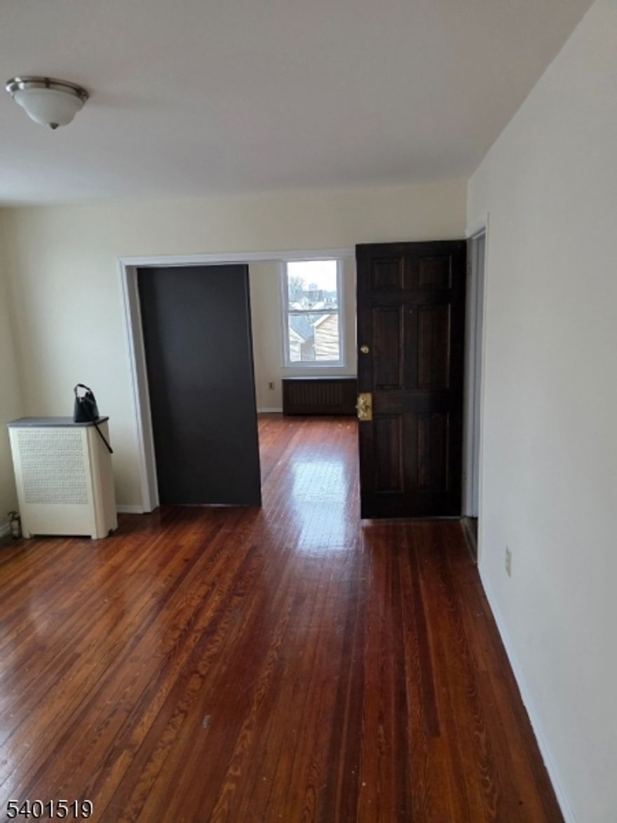 Very spacious 3 bedroom apartment with one full bath, kitchen, living. room. The apartment is also equipped with a stove and refrigerator. There is also a fourth bonus room that can be used as a den or home office.