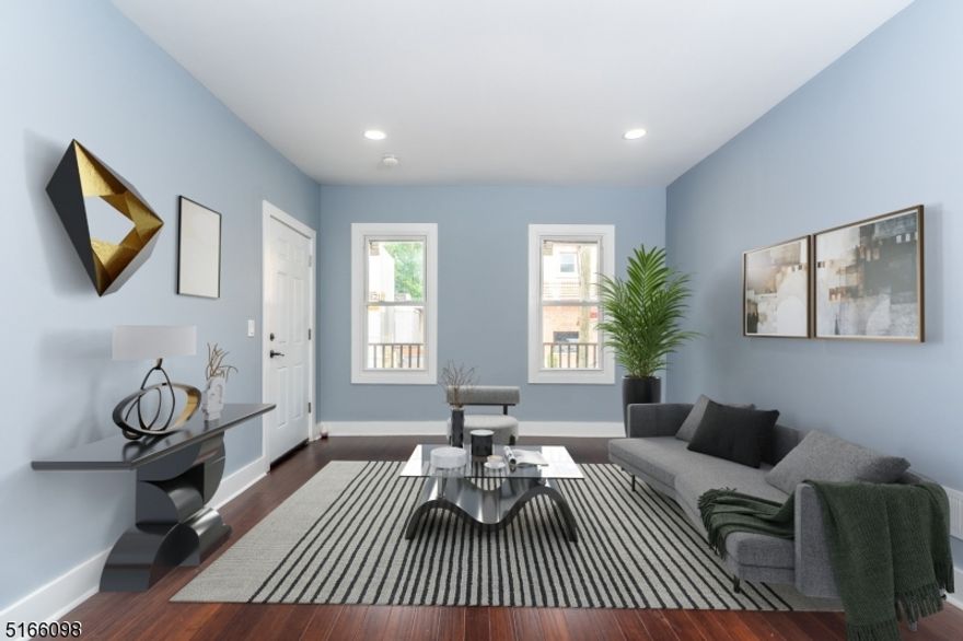 Down to the studs and now completely redone this stunning two-family home in prime location is ready for new owner! Everything NEW! Including roof, furnaces, water heaters, kitchens, baths, and much more! First floor with open floor plan, living room and gorgeous kitchen with center island, Two good size bedrooms and totally renovated full bath.First floor has access to the spacious backyard great to enjoy during hot summer days! Second floor with two levels. Second level with open floor plan eat in kitchen with center island, living room, full bath and one great size bedroom. Third level with two bedrooms, and utility closet with laundry hook ups. Full unfinished basement with lots of storage and endless possibilities. Ideally located close to public transportation, shops, and major highways bordering West Orange.  This is a must See!