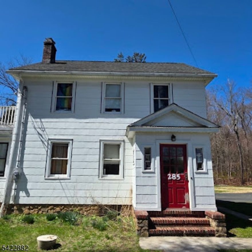 Charming and spacious Colonial set on a beautiful level property, offering the perfect blend of country living with convenient access to major highways, transportation, and shopping. This generously sized home features 5 bedrooms, including an oversized primary bedroom, along with 2 full baths.Inside, you'll find beautiful hardwood floors and a warm, inviting living room highlighted by a wood-burning stone fireplace. The main level also includes a formal dining room, kitchen, and a versatile bonus room/den ideal for a home office or flex space. Sliders from the dining room lead out to a wood deck, perfect for outdoor entertaining.Additional features include a walk-up attic, a large basement, and an oversized 2-car garage. One of the bedrooms offers access to a private balcony, adding to the home's charm and character. The expansive driveway provides ample parking.With solid bones, classic appeal, and generous living space, this home is ready for your personal touch bring your vision and make it truly your own. A fantastic opportunity to create your dream home in a desirable setting.  Radon system and water softener included.