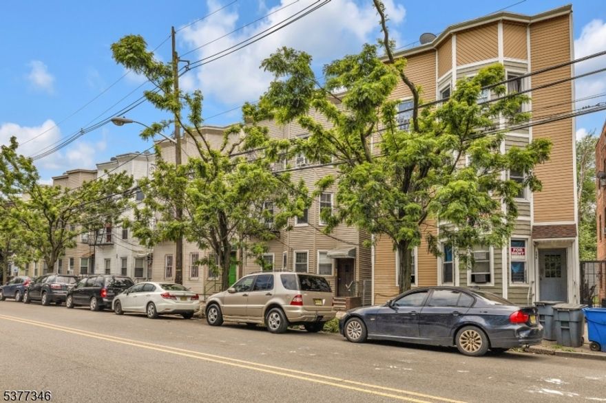 Fully occupied and recently updated, this 6-unit commercial apartment building delivers immediate cash flow with room for growth. Featuring five spacious 2-bedroom units and one 1-bedroom unit, plus six basement storage units for additional rental income, this property is designed for strong returns. Five of the six apartments have been renovated, attracting quality tenants and reducing maintenance costs. Located in the heart of Passaic with easy access to Route 21, Route 3, I-80, and NYC, the property sits in a high-demand rental market with minimal vacancy. Tenants enjoy proximity to major retailers like Home Depot, grocery stores, dining, public transportation, and essential services. With a current 6.7% cap rate and bonus income potential from storage rentals, opportunities like this are rare in today's market. Act quickly " this income-producing asset will move fast.