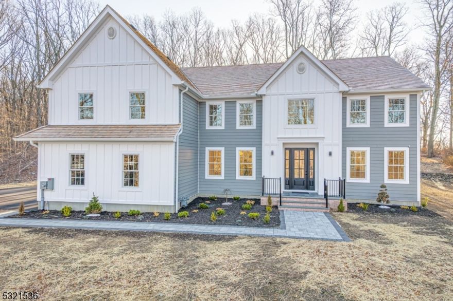 Introducing a stunning new construction nestled in The Hedgerows, an upscale community that embodies the timeless charm of a New England village. Each home is uniquely designed, showcasing exquisite reproduction colonials that blend classic architectural details with modern comforts.This exceptional residence, set for completion in early 2025, features a cedar roof, Hardie Plank siding, and premium Andersen windows. Inside, elegant crown molding and a coffered ceiling create a sophisticated ambiance throughout this 4-bedroom, 5-bathroom home. The open-concept layout includes a chef's dream kitchen equipped with high-end finishes and stainless steel appliances.The second level boasts a primary suite with tray ceilings, two spacious dressing closets, and a spa-like bathroom complete with a soaking tub and large shower. One of the three additional bedrooms also includes its own bathroom and ample closet space. The first floor features a versatile office/den and a full bath conveniently located near the mudroom and kitchen area.The fully finished basement adds to the home's allure, featuring a recreation room, entertainment space, and an additional bath. A two-story great room with 9-foot ceilings enhances the expansive feel of the home. Outside, a patio and daylight basement provide additional space for relaxation, while the spacious backyard invites outdoor enjoyment.