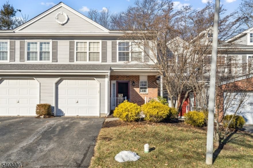 PROFESSIONAL PHOTOS ARE HERE!   - Step into this beautifully upgraded Alpine model, where every detail is designed for modern living..The open floor plan creates a welcoming atmosphere. Enjoy cozy evenings by the fireplace, featuring a stylish slate surround and classic white mantle, or step through the sliders onto your private patio an ideal spot to unwind while taking in the serene backyard and the sights and sounds of nearby birds and wildlife. The spacious master suite is a true retreat, boasting a vaulted ceiling, walk-in closet, and a luxurious master bath with a large shower, skylight, double-sink vanity, and linen closet.  The second level also features a generously sized bedroom, a full bath, and a flexible den perfect for work or hosting guests. The kitchen is a chef's dream, equipped with newer Samsung appliances, a five-burner range, granite countertops, and a breakfast bar for casual meals and gatherings. Additional conveniences include a first-floor powder room and a separate laundry room, adding to the home's functionality and ease. Enjoy peace of mind with a new roof and take advantage of the Seasons Glen community amenities: a sparkling pool, well-equipped gym, tennis and basketball courts, playground, and a welcoming clubhouse. All this, just minutes from shopping, dining, and major commuting routes, makes this home the perfect blend of relaxation, recreation, and convenience.