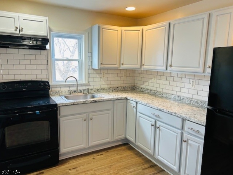 Updated 2 Bedroom Apartment! Newly Updated Kitchen, Bathroom & Flooring! Stackable Washer/Dryer, Walk up Attic, Screened In Front Porch & More! Must See!!! Great Rental!!!