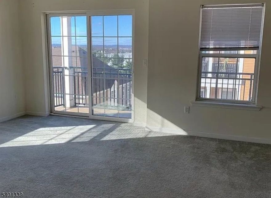 A commuter's delight! This lovely, bright, brand-new top-floor condo features elevator access and is just steps from the shuttle bus to the train station. Ideally located near shopping and major highways. Enjoy a modern kitchen with ceramic tile flooring, 42-inch cabinets, and granite countertops. The spacious primary bedroom includes a walkin closet and a double-sink vanity, while the second bedroom also offers its own walkin closet. Additional highlights include a private balcony, an in-ground community pool, and a play area with swings.