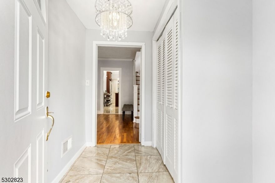 Immaculate Colonial Home with Open Floor Plan and Modern Upgrades! Located in the Conant/ Westminster section in Hillside, this beautifully updated single-family home perfectly blends classic charm with modern luxury. The stunning entrance give access to the first floor which boasts an open floor plan, creating a seamless flow between the cozy den, elegant living room, and formal dining room all featuring gleaming hardwood floors. The updated kitchen, with modern appliances and stylish finishes, is a central hub for cooking and entertaining. The Second floor with new hardwood floors offers three bedrooms and a stunning bathroom with a soaking tub and separate stall shower. The finished attic provides additional storage space. The fully finished basement includes a family room, a full bath with a separate entrance, offering versatile living options. Two zone central AC and Heating. Owned Solar Panel for energy savings!  Step outside to a gorgeous deck overlooking the yard, perfect for outdoor gatherings. The property also features a two-car detached garage and a driveway with space for 3-4 cars. This immaculate home, with its open floor plan and thoughtful upgrades, is move-in ready and offers modern comfort with timeless appeal.  Some of the upgrades include Garage, siding, roof, kitchen, central AC, and renovated bathrooms all done in the last 6 years. List of upgrades available. Schedule your showing today!