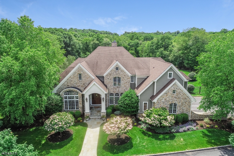 European country style estate with 4.37 acres of professionally maintained land, this magnificent home blends modern living with traditional style. State of the art amenities and open floor plan. Gourmet kitchen w/ 2 islands, custom built-ins, separate eat-in area, walk-in pantry and high end appliances. Family room with built-in entertainment center, Sunroom, Master Suite w/ balcony , custom wall finishes, radiant heating including garage, pool complex with blue stone tiers, full house generator, finshed Ground level with theater, exercise room (bedroom #6), wet bar, craft room, full bath and more. One of the 4 fireplaces is wood burning (kitchen and family room see-thru fireplace). Two laundry rooms, second floor in-law suite opportunity with full size kitchen. Located in top-rated school system.