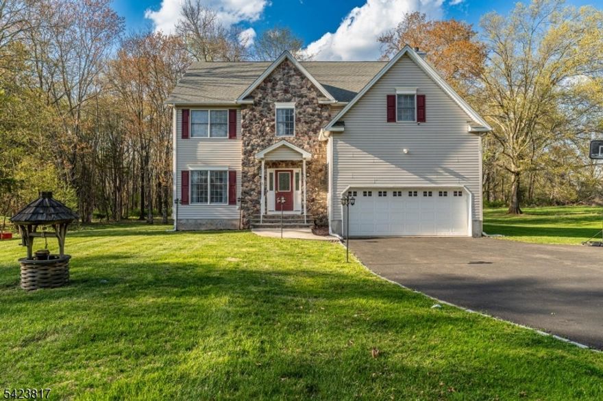 Welcome to beautifully updated 4 bedroom home where you will find many updates! Spacious kitchen with center island and breakfast bar equipped with CAFE appliances. The family room offers soaring ceilings enhanced by brand new traditional wainscoting, adding timeless architectural detail. A statement chandelier and large windows fill the space with natural light, creating a bright and open atmosphere. Decorative picture frame molding adds elegance throughout, while a fireplace serves as a warm focal point. Brand new rich hardwood floors on 1st and 2nd floors, staircase with classic white balusters and dark handrails complete this beautifully appointed living space. Enjoy a serene, spa-like main bathroom featuring a modern freestanding soaking tub positioned beneath a window for natural light. The space is finished with oversized porcelain and ceramic tiles designed to mimic natural marble, seamlessly covering both the walls and floors for a clean, high-end look. Completing this exceptional home is a peaceful backyard retreat, perfect for relaxing evenings or weekend entertaining. Every detail has been carefully curated to create a space that feels both luxurious and welcoming. This beautifully updated property is truly move-in ready and waiting to be enjoyed. Home offers a brand new water filtration system and whole house generator.
