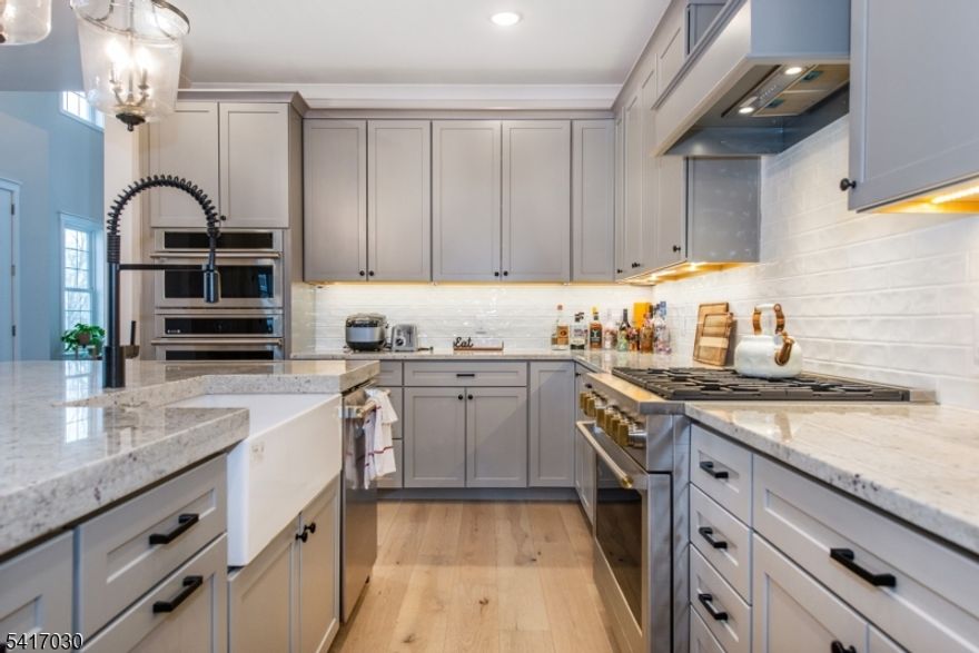 Almost new end-unit townhome in the Enclave at Hillandale. This is the largest model with nearly 4500 sq. ft. of space, in a premium location; private, along with gorgeous sunrise and mountain views. Special features include a gourmet kitchen with oversized center island, butler's pantry, first floor master suite with customized walk-in, designated home-office area with French doors, two-story great room with gas fireplace, deck, second floor loft/rec room, 3 additional bedrooms all with private full bathrooms and walk-in closets, a finished walk-out basement, ground-level patio area, multi-zone heating & AC, and oversized garage.