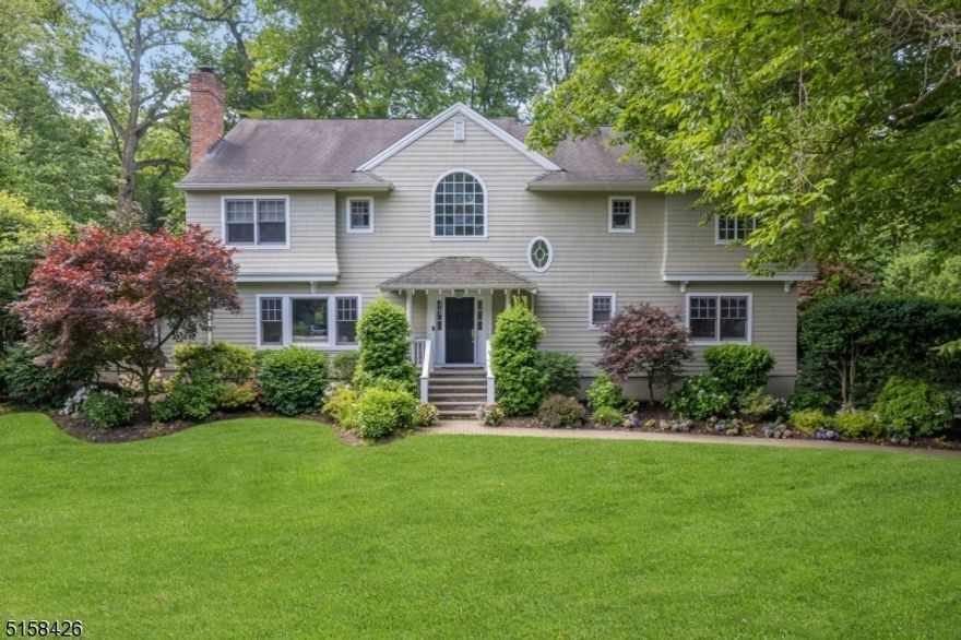 Located in an idyllic treelined Northside neighborhood and only .8 of a mile to Summit NJ Transit Train Station, this newer construction Colonial provides a modern floorpan and over 4,000 sq. ft. of fine living space. With its flexible floorpan, the first floor includes a chef's eat-in kitchen with center island, Viking Range, Subzero refrigerator and crisp white cabinets opening to a large family room. A first floor bedroom with full bath, large, sunlit fireside living room next to an office, a grand dining room, a dramatic two story foyer and a large bonus room with built-ins ideal for a second family room or den complete this level. The second floor offers a large primary bedroom with vaulted ceiling, dual walk-in closets and a full bath with two sinks, a whirlpool tub and steam shower. Three additional bedrooms, a hall bath and a Jack and Jill bath round out this level.  The lower level with its high ceiling includes ample leisure space, the laundry room, a mud room, a full bath and a large walk-in storage closet. The oversized two car garage is accessible from the lower level mudroom.  The fully fenced backyard with bluestone patio has access points across the rear of the home providing great flow for entertaining. Mature landscaping provides privacy and surrounds the flat backyard, offering an ideal environment for enjoying the warmer weather.