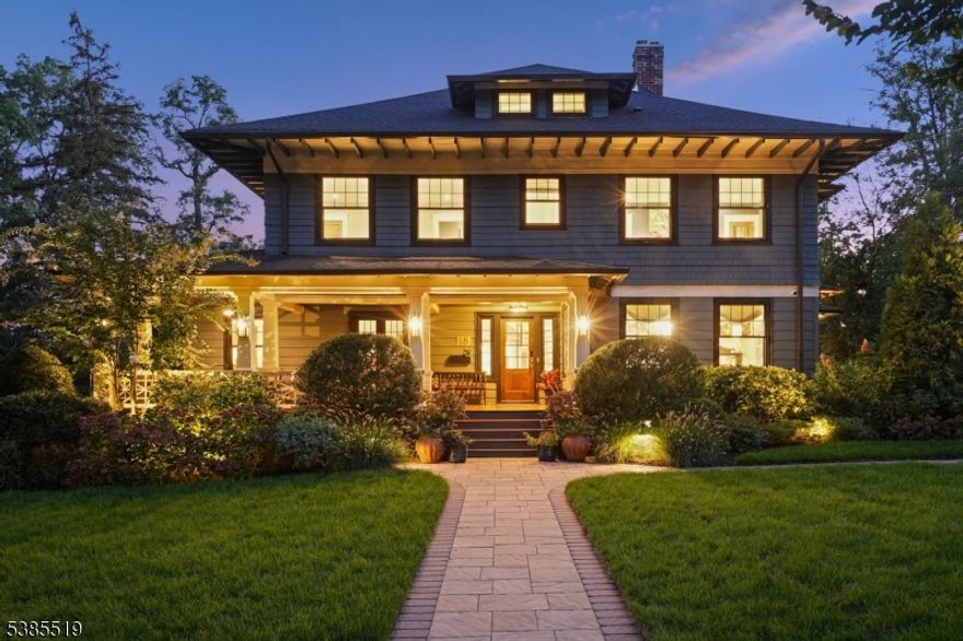 Stunning, sophisticated and renovated to perfection, this breathtaking 6 bedroom, 5 bath colonial showcases exquisite taste, superb design and supreme functionality. Luxurious living areas and meticulously curated outdoor spaces offer a unique blend of timeless elegance and understated luxury. The welcoming front porch leads you to a front foyer with coat closet. A spacious, light-filled living room opens to a wood-paneled library meticulously renovated in 1930. The dining room, with original stained glass windows, wood-burning fireplace and custom moldings provides the perfect setting for intimate gatherings. A showstopping double-height kitchen designed by award-winning Plumberry Designs includes Tedwood custom cabinetry, Thermador, JennAir and Sub-Zero appliances, Brizo faucets, a separate bar area/wine storage, and a generous-sized separate pantry with second dishwasher. The adjoining family room with direct-vent gas fireplace is anchored by custom glass doors leading to outdoor patios. A powder room completes this level. The second level offers four bedrooms, three full baths and convenient laundry while the primary bedroom includes three custom closets, a luxurious full bath with double vanities and oversized steam shower. Walk up to two additional bedrooms and full bath. The finished lower level includes a game room, second laundry and gym. Located on one of Maplewood's most sought-after tree-lined streets with vibrant downtown and train access to NYC just steps away.