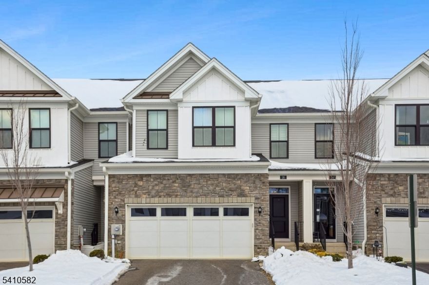 Built in 2020 by Toll Brothers, this 3-bedroom, 4-bath colonial-style townhome in Monroe Place delivers over 2,600 sq ft of stylish, flexible living across four beautifully finished levels. The open-concept main floor showcases hardwood floors, upgraded lighting, and a stunning kitchen featuring quartz countertops, stainless steel appliances, a large pantry, and a statement island with custom navy base. Sliding glass doors lead to a private deck area for outdoor enjoyment. A rare highlight is the first-floor bedroom or home office paired with a full bath - ideal for guests, remote work or or one floor living. Upstairs, the spacious primary suite includes a walk-in closet and elegant en-suite bath with dual vanities. Two additional bedrooms share a full bath, and the second-floor laundry adds convenience. On the top level, discover a third-floor den perfect for a home office, creative studio, or gaming retreat. The fully finished lower level offers a fourth full bathroom and open rec space - ideal for a gym, playroom, or home office. Enjoy a two-car garage with EV charger, two-zone HVAC, and elegant interior finishes throughout. Prime location near Rt 33, Rt 130, NJ Turnpike, shopping and dining - offering unmatched convenience for commuters. Schedule your private showing today!