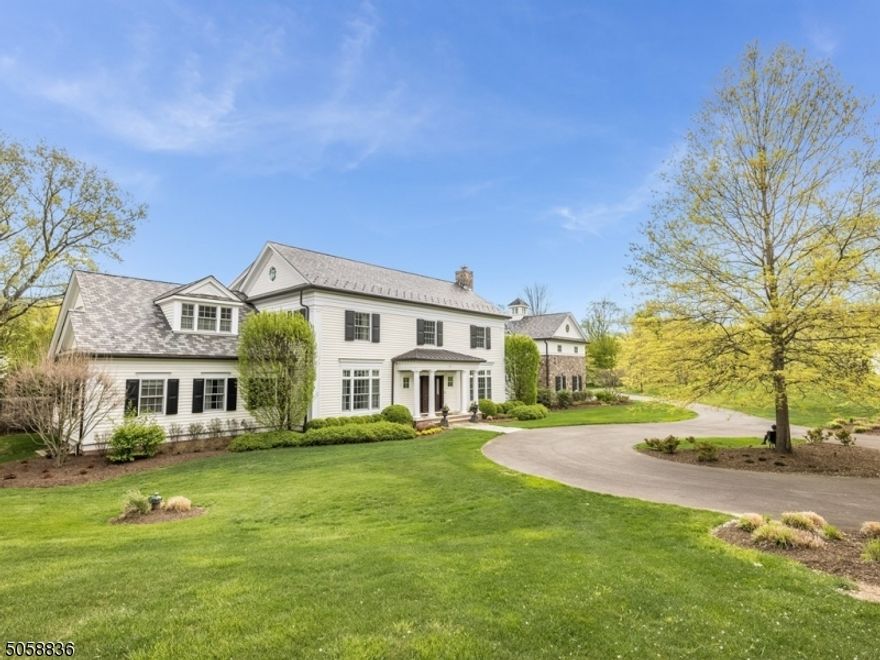 A private, tree-lined road leads to this magnificent 5 bedroom, 6 full bath Colonial set on 6.8+ acres in a very desirable Harding location. Constructed by John McFayden, this fine country estate is sophisticated, yet comfortable, with a well-designed floor plan where entertaining and everyday living are equally served. Highlights include custom molding detail throughout, a chefs kitchen, a private first-floor primary wing with 2 full baths and 2 walk-in closets, a hidden passageway leading to a private home office, a gym, bonus room, elevator, and lush flat grounds including a bluestone patio.