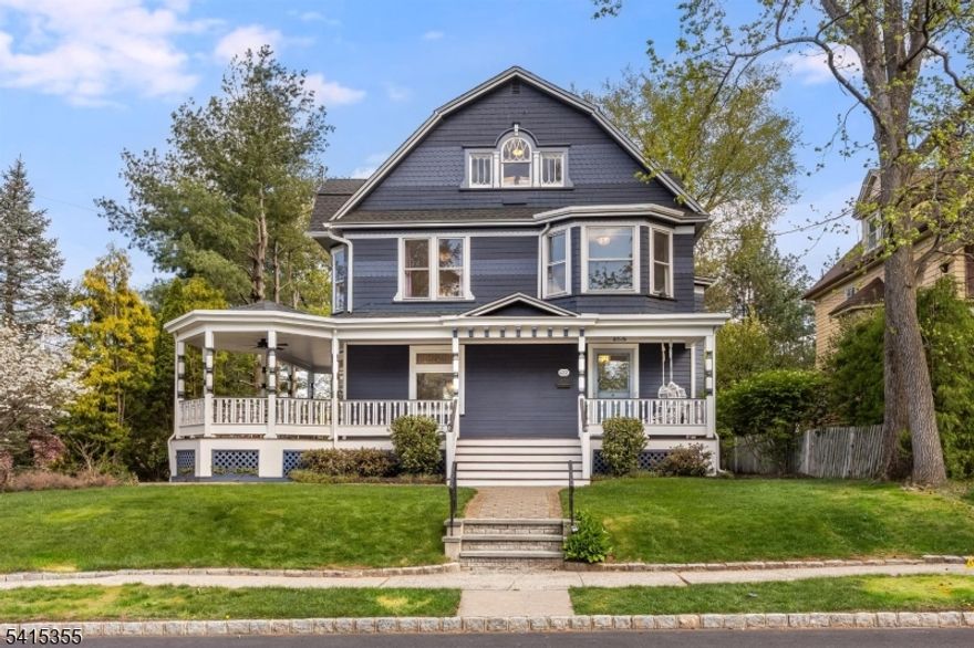 Turn-of-the-century Colonial Victorian with exceptional character and myriad modern upgrades, ideally located just steps from Mindowaskin Park, and moments to the shops and dining of downtown Westfield, NYC transit, and top-rated schools. This home features 9'+ ceilings, original floors with walnut inlay, detailed moldings, and pocket doors. A grand foyer leads to a sunlit living room and an oversized dining room with wood-burning fireplace, perfect for entertaining. The chef's kitchen (2018) includes a double Viking stove, stainless steel appliances, center island with wine fridge, built-ins, pantry, and convenient half bath. The second floor offers a primary suite with en-suite bath, three additional bedrooms, and a full hall bath (2018). The third floor includes two more bedrooms, office/flex space, and additional full bath. Outdoor spaces include a classic wraparound porch (renovated 2025), European-style tiled patio, and partially fenced yard. Extensive updates include roof and gutters (2025), HVAC systems (2021 & 2024), upgraded electrical throughout with Ethernet to each floor, select Pella replacement windows, Hardie and cedar siding, and a Level 2 EV charger. A rare opportunity combining timeless architecture, modern comfort, and an unbeatable Westfield location.