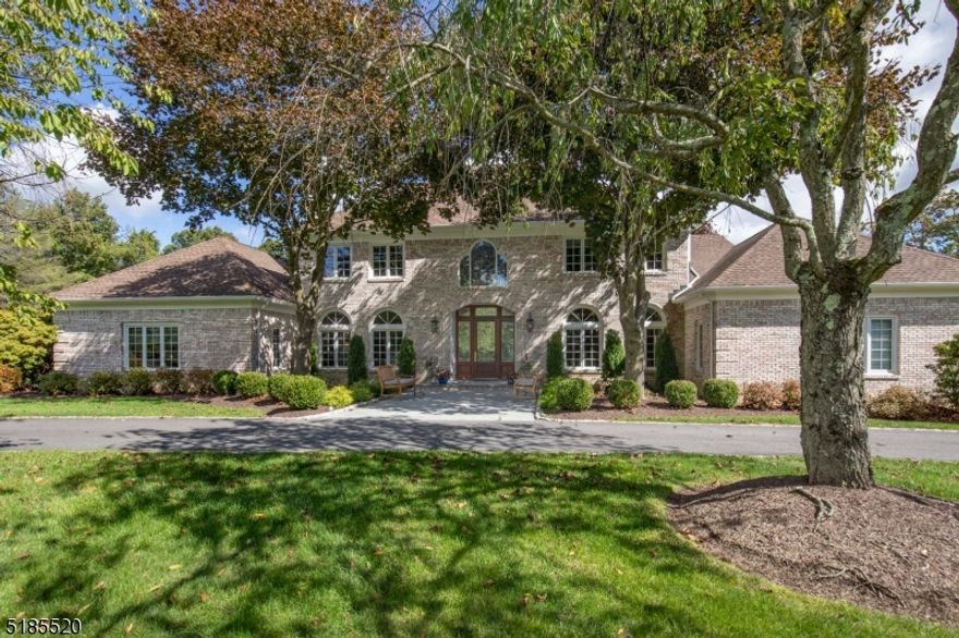 A beautifully updated, brick front Georgian Colonial estate home, is perfectly sited, on 3 private acres, in a cul de sac neighborhood, adjacent to  parkland. There is a fresh contemporary look throughout from a new color palette, technology upgrades, a bright open floor plan & high ceilings. Magical grounds include sweeping level verdant lawns with established trees, perennial gardens and sparkling inground heated pool - a  perfect resort like setting. The dramatic two story foyer featuring new porclain floor, stunning circular staircase and new LED lighting sets the tone as you enter the home.The magnificent great room boasts a cathedral ceiling, 4 skylights,gas fireplace, hardwood floor and new Andersen French doors to the expansive deck. The gourmet kitchen with large eating area overlooking backyard has center island/breakfast bar with quartz counters, top of the line appliances custom white cabinetry and subway tile backsplash.An impressive laundry area, & butler's pantry are nearby.The stunning formal dining room & sophisticated living room,both with fireplaces are just off the foyer.The first floor stunning primary suite has a oversized bedroom with fireplace & gorgeous updated bath. An impressive wood paneled library is also in this area. The second floor presents 3 additional updated bedrooms and en suite baths with updates. An office & a possible additional bedroom and an updated hall bath are also featured on this floor. 3 car garage & generator. 4 bedroom septic.