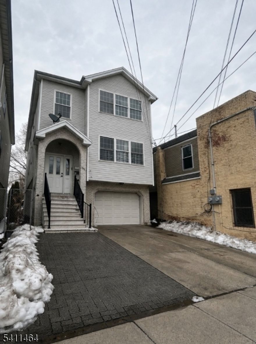 ALL UTILITIES INCLUDED! This well-appointed 3-bedroom, 2-bathroom first-floor unit offers an ideal blend of comfort and convenience. Featuring hardwood floors throughout, a master suite with walk-in closet and private bathroom, in-unit laundry, central heating and air conditioning, and a dedicated driveway parking space. Enjoy a shared backyard and a location minutes from shopping, public transportation, and major highways perfect for modern city living.