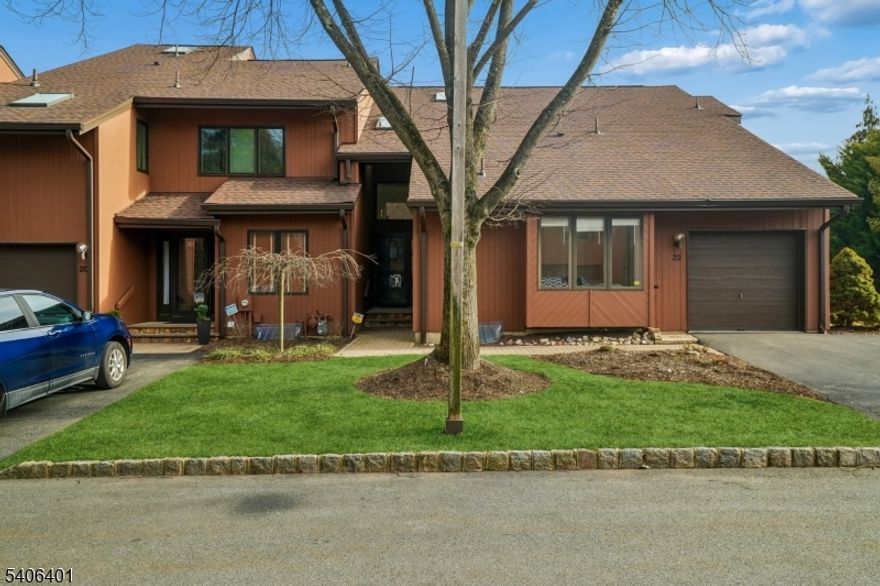 Offering exceptional space, storage, and flexibility, this move-in-ready Woodlands end-unit features a highly desirable first-floor primary suite and a thoughtfully designed layout for effortless living. Ideally located near shopping, houses of worship, Verona Park, Eagle Rock Reservation, major highways, and jitney service to NYC trains, it offers the perfect balance of convenience and lifestyle. Minimal steps lead to a covered entry and welcoming foyer. The open living and dining area is bright and dramatic, with soaring double-height ceilings, skylights, a gas fireplace, and sliders to a private rear deck ideal for everyday living or entertaining.The main level includes a spacious primary suite, eat-in kitchen, powder room, laundry, home office, additional bedroom, and Jack-and-Jill bath, allowing for comfortable one-level living with flexible use of space. Upstairs, a generous bedroom with en-suite bath serves as an ideal alternate or additional primary suite. Storage is abundant throughout, including a walk-in cedar closet and multiple well-organized storage areas.The walk-out finished lower level adds even more versatility with a large family/rec room, fourth bedroom with adjacent full bath, laundry room, and two bonus rooms perfect for a gym, work-from-home space, or additional storage. An attached garage provides secure parking and easy day-to-day access. Community amenities include an outdoor pool, tennis and paddle courts, gym, and clubhouse. 2025 Taxes are $17,386.