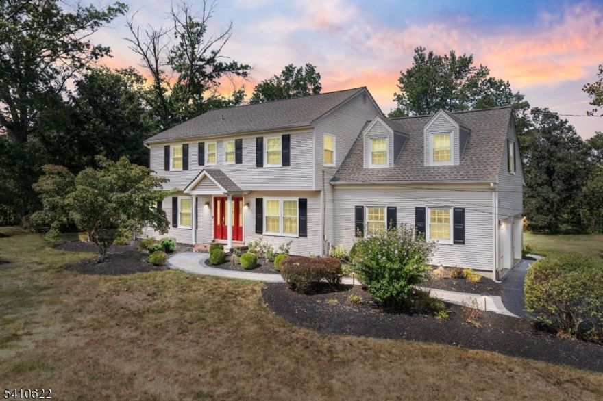 Timeless charm and everyday comfort define this beautifully maintained Colonial. Offering four spacious bedrooms and a dedicated home office, the home features thoughtful updates throughout. Hardwood flooring runs across both levels, creating a seamless and inviting feel, while recessed lighting brightens every room. The formal living room flows easily into the welcoming family room, complete with a gas fireplace and plenty of natural light. A full bathroom on the main level adds convenience for guests. In total, three updated full bathrooms offer tasteful finishes and practical functionality for daily living. The kitchen is truly the heart of the home, showcasing warm honey maple cabinetry, high end stainless steel appliances, a ten foot center island perfect for gathering, granite countertops, glass front accents, and a blend of pendant and recessed lighting. Sliding doors lead to an expansive paver patio overlooking a peaceful, park like backyard that is ideal for entertaining or simply enjoying the outdoors. The finished basement adds valuable additional space with a large recreation area, private office, and a laundry room with built in cabinetry and ample storage. Major improvements include a new roof in 2022, a furnace in 2023, and updated central air conditioning. A two car garage with automatic openers provides everyday convenience. Located in a Blue Ribbon school district and close to shopping and dining, this home offers both comfort and an exceptional setting.