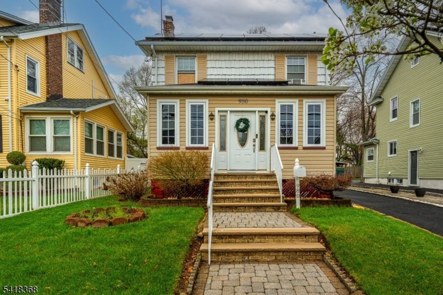 Located in the sought-after Putnam Manor neighborhood of Union, this move-in ready Colonial balances classic curb appeal with contemporary design. The journey begins on the covered front porch that sets a welcoming tone. Inside, the main level feels expansive, anchored by rich hardwood floors and an open-concept flow that connects the living and dining areas directly to the heart of the home. The kitchen is a standout illuminated by modern recessed lighting that keeps the space bright at any hour. The second level offers three comfortable bedrooms and a spa-inspired bathroom that truly breaks the mold, boasting floor-to-ceiling marble-style tile, luxe gold fixtures, and a high-tech rainfall shower system with massage jets. If you need storage, the spacious walk-up attic provides a massive footprint for all your seasonal gear. For even more living space, the fully finished basement serves as a family room or "flex" space, complete with its own laundry area and a second full bathroom, adding incredible value and convenience. Outside you'll find a long driveway that leads to an oversized detached 2-car garage. The paved patio is the ultimate spot for summer hosting or weekend relaxation. For the commuter, the location is unbeatable you are just a half-mile from the Union Train Station and Kean University, with the bus routes of Morris Avenue just minutes away.