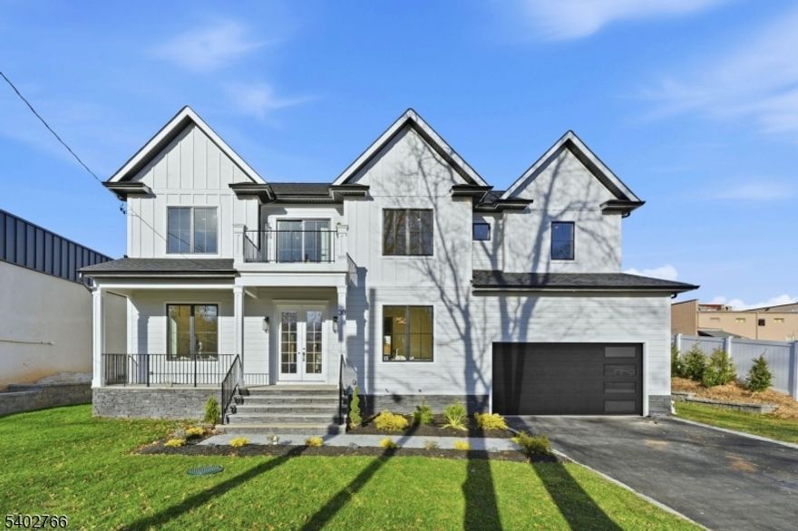 Stunning brand new construction offering 6 bedrooms and 5.5 bathrooms. Step through the grand two story foyer into elegant formal living and dining rooms.The gourmet kitchen is a chef's dream, featuring premium stainless steel appliances, a walk-in pantry, a dedicated bar area, large center island and an open concept layout that flows into the double height family room with fireplace. Sliding glass doors provide easy access to the backyard, while an overlook from the second floor hallway adds architectural interest.The first level also includes a private first floor bedroom with en suite bath and walk in closet as well as a mudroom, powder room, and direct access to a two car garage.Upstairs, the luxurious primary suite boasts his and hers closets, a soaking tub and stall shower, and a private balcony overlooking the backyard. Three additional bedrooms include a junior suite with its own bath, as well as two bedrooms that share a well appointed hall bath. A front facing balcony and a central laundry room complete the upper level.The fully finished basement is designed for both relaxation and functionality, offering a spacious recreation area, media room for movie nights, a sixth bedroom with full bath, ideal for guests, an enclosed home office.