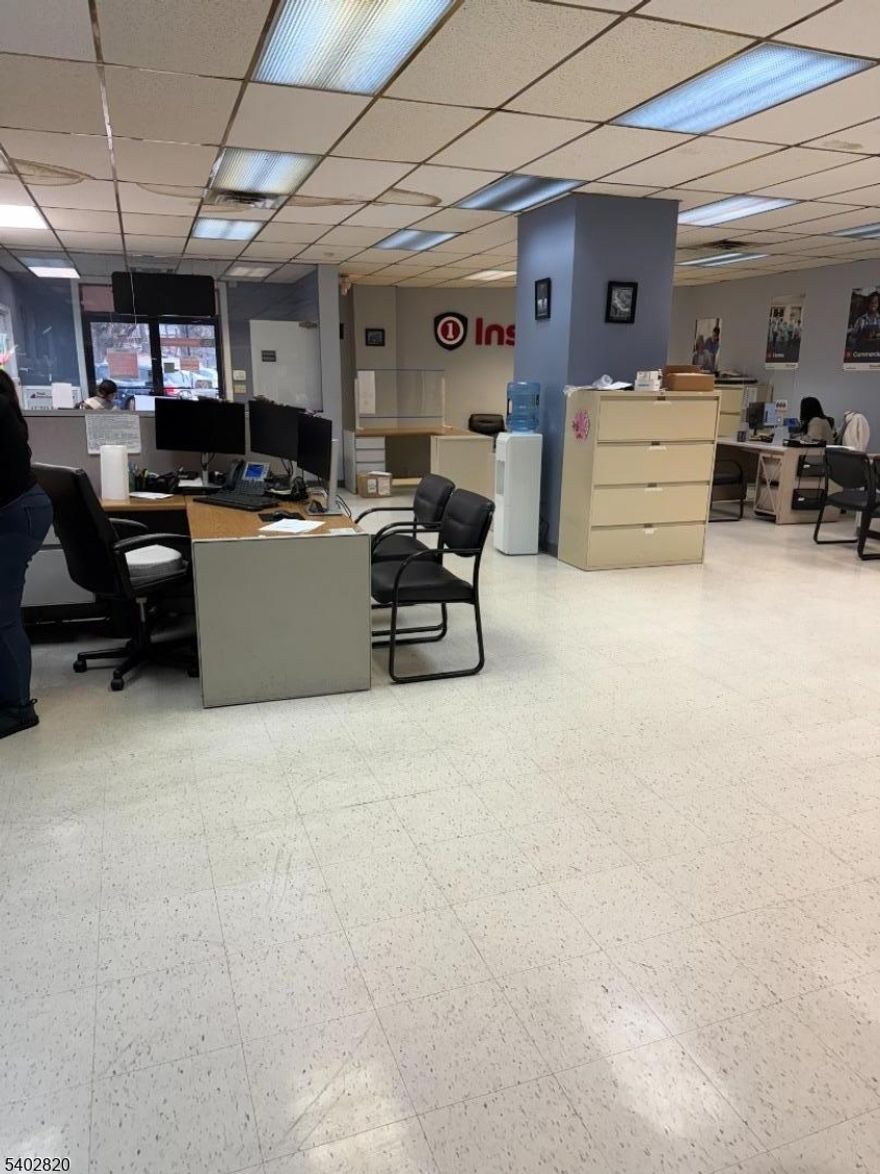 1838 SF ground-floor office space at 54 Main Street featuring a large open work area ideal for collaborative use, two private office rooms, and a private bathroom. Convenient street-level access makes this space easy for clients and staff. A free city parking lot located directly across the street adds exceptional convenience. Flexible layout suitable for a variety of professional uses. Floor plans available upon request.