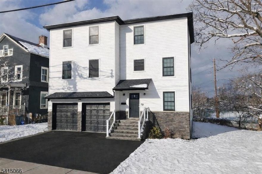 Newer construction legal two family home situated on a corner lot in Bloomfield offering approximately 3,654 square feet with a flexible multi level layout.Unit 1 " First and Ground Floor Living Arrangement offers 4 bedrooms and 3 full bathrooms. The ground level extended suite is connected internally to the first floor and provides additional finished living space including an entertainment area, wet bar, dishwasher, separate washer and dryer, engineered hardwood flooring, and access to a private balcony overlooking the rear yard. This space is part of Unit 1 and is not a separate apartment.Unit 2 " Second Floor Residence features 4 bedrooms and 2 full bathrooms with open living and dining areas and a modern kitchen layout.Both residences include stone countertops, 42 inch cabinetry, breakfast bar seating, dishwashers, primary bedroom ensuite bathrooms, and in unit stackable washer and dryer.Conveniently located approximately one half mile from the Bloomfield NJ Transit train station with direct service to Hoboken and connections to New York City. Easy access to the Garden State Parkway, Route 3, and Interstate 280. Close to Bloomfield Center shopping, dining, and local amenities.Move in ready legal two family home offering a flexible multi level layout with extended living space.