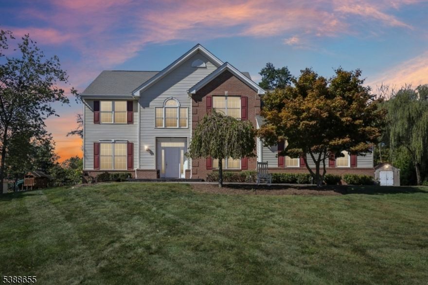 Welcome to "Heights of the Hamptons"!This stunning four-bedroom Colonial in desirable Hunterdon County is tucked away in a serene cul-de-sac neighborhood. It sits proudly on a full acre of land, while still offering easy access to all major highways. Step inside to an open floor plan that begins with an elegant foyer, highlighted by a sweeping staircase and flanked by formal living and dining rooms. The gourmet kitchen is a true showpiece, boasting a center island, granite and quartz countertops, and sliders leading out to a private, paved backyard complete with a gazebo and a BBQ area perfect for entertaining. Additional main-level features include a spacious family room with a pellet fireplace, a private office, and a convenient laundry room. Upstairs, the luxurious primary suite offers a generous walk-in closet, a sitting room, and a spa-like bathroom with a soaking tub and stall shower. Hardwood flooring flows throughout the home, adding warmth and elegance. A partially finished basement provides extra living space and endless possibilities.