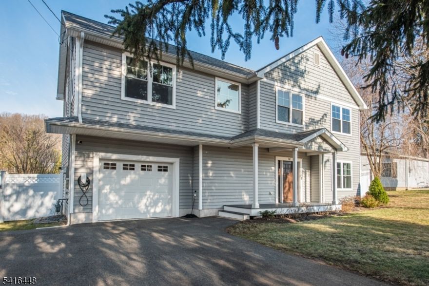 Rare move-in-ready opportunity in one of Denville's most sought-after neighborhoods. Renovated with a fresh, contemporary feel, this 4-bedroom Colonial offers the modern updates buyers are searching for in a market where homes like this are rarely available.Inside, high ceilings and luxury vinyl plank floors create a bright, open feel throughout the main living spaces. The white kitchen is designed for both style and function, featuring quartz countertops, clean modern finishes, and plenty of space for everyday living and entertaining. With 4 bedrooms, 2.5 baths, the layout offers flexibility for today's lifestyle. Second floor laundry adds to the convenience. The primary bedroom has a walk-in closet and bathroom w/stall shower and double sinks.A one-car attached garage and an electric vehicle charging station, an increasingly valuable feature for modern homeowners.Step outside to a fully fenced backyard designed for relaxation and play. Enjoy gatherings under the large pergola on the paver patio while the playset creates a ready-made space for outdoor fun. The privacy fence adds both comfort and seclusion. ADT Security, Set on a quiet street in one of Morris County's most desirable towns. Known for its vibrant downtown, great restaurants, and commuter convenience this home combines thoughtful updates with an unbeatable location.Inventory in Denville is limited, especially for renovated homes like this. Opportunity is knocking don't miss your chance to make it yours.