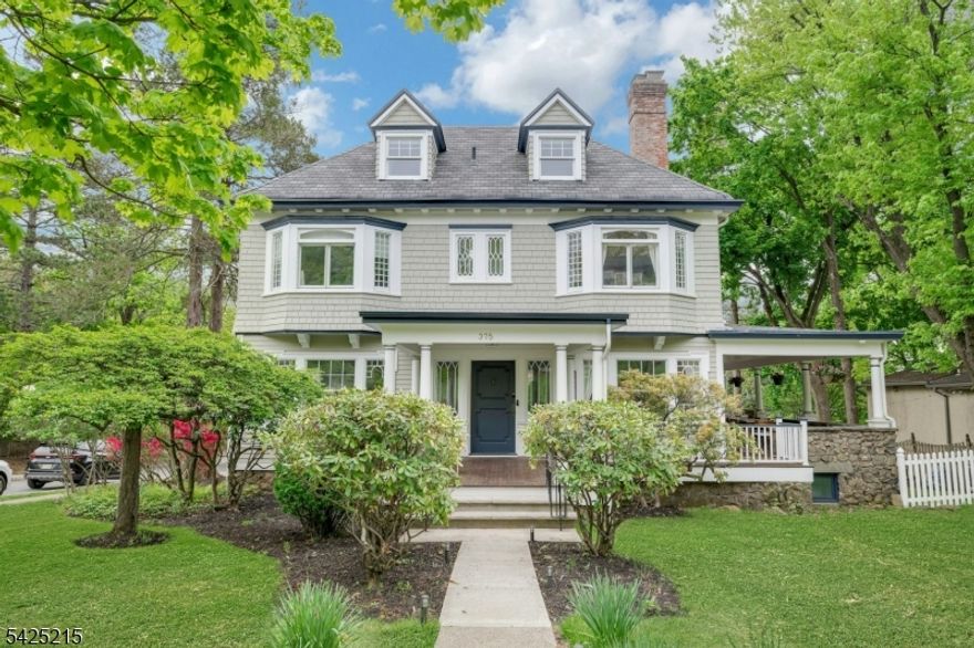 JUST Listed in Montclair, New Jersey   The Montclair lifestyle New York buyers search for. Ideally located just one block from the NYC direct train with an easy Midtown commute, and moments to vibrant Uptown Montclair filled with top-rated restaurants, cafes, boutiques, and parks. This sun-drenched, move-in ready home offers 6  BRs 3 full and 2 half baths with a flexible floor plan perfect for today's lifestyle. Timeless charm meets modern updates throughout, featuring a classic wraparound porch for seamless indoor-outdoor living, now complete with a built-in projector for elevated entertaining and outdoor movie nights. Kitchen w/Sub-zero & Viking applcs opens to a private deck, creating the perfect flow for indoor-outdoor dining, while the backyard is thoughtfully designed with a paver patio, BBQ area, & a lounge space strung with ambient lighting   ideal for hosting or relaxing year-round. Inside, enjoy bright, airy living spaces, high ceilings, and abundant natural light. The finished basement adds bonus living space that can be divided with built-in pocket doors,  with a recreation area, perfect for a playroom, gym, or media lounge. Recent upgrades include a newer roof & EXT Paint (3 years) offering peace of mind. Set on a beautiful, tree-lined street in one of Montclair's most desirable neighborhoods, A rare opportunity combining location, space, and lifestyle. Perfect for buyers seeking that true Montclair feel with effortless access to NYC!MAKE THIS YOUR NEXT ADDRESS!