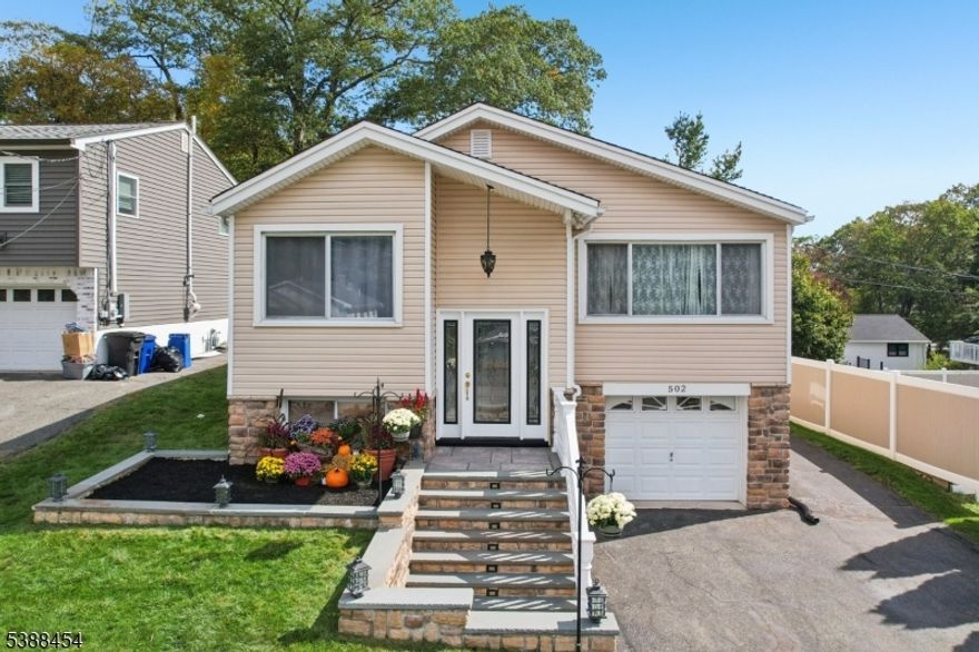 Discover this exceptional 4-BR, 2.5-bath home in Roxbury Township's coveted Landing Section. This residence which has great curb appeal, offers both convenience and quality. Perfectly designed for comfortable living and impressive entertaining, it's the ideal lake lifestyle retreat. Main level features beautiful hardwood floors that add warmth and character throughout. The kitchen is open to the bright dining and living rooms. The primary suite provides a peaceful sanctuary with generous proportions. The true showstopper lies on the lower level a dedicated entertainment haven transformed into the ultimate hangout space. Durable ceramic tile flooring spans the entire lower level, making it both stylish and practical. A former bedroom now accommodates a striking custom bar, while the home theater setup creates an immersive screening experience perfect for movie nights & game days. This entire level is designed for bringing people together. Outside, the flat, grassy, and fully fence backyard offers a private oasis for relaxation or summer gatherings. The meticulously maintained one-car garage showcases exceptional organization. Generous attic space is accessible via pull-down staircase for added storage. Natural gas, public sewer and water. Please note: Bar area can easily convert back for the 4th bedroom. The elaborate aquatic fish tank systems w/ custom filtration & the home theater sound system are not included list price-(negotiable)