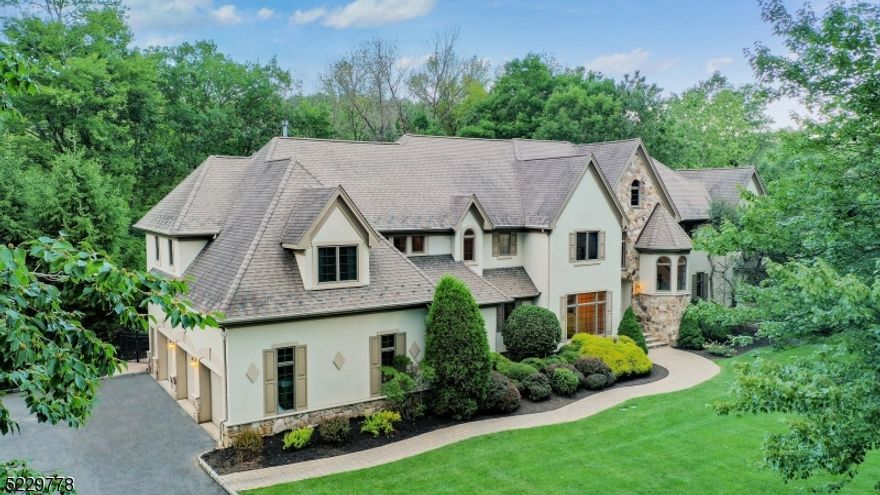 Elegant custom built & meticulously maintained 6 BR, 5.1 BA home on over 2 acres, distinctive architectural elements thru-out.  Main level highlighted by 2-story family room w/ wet bar & stately mountain inspired wood burning fireplace.  Gourmet kitchen, granite countertops, new refrigerator, gas fireplace, expansive prep island & large eat-in breakfast area w/skylights & walls of windows to enjoy backyard's beautiful natural landscape.  1st floor guest suite & FB offers a next level hospitality for your guests.  1st floor office provides ideal work-from-home space.  Dual staircases lead to upper level w/ an exquisite primary bedroom retreat features fine wood trim, coffered ceilings w/ surround sound, sitting area w/ gas fireplace, large walk-in closet, wall of panoramic windows overlooking the backyard oasis and an en suite w/ jacuzzi tub.  2 more BRs w/ en-suite baths & 2 BRs w/ jack & Jill bath complete the 2nd floor. Walkout basement. Decompress & unwind in the privacy of fully fenced-in yard w/ mature landscaping while relaxing in the heated salt water pool featuring waterfall & hot tub.  Located in a most sought after neighborhood & excellent school district, close to downtown Warren & highways 78 & 22. 30 minutes from Newark Airport, 1 hour from New York City(with close-by park and ride); 3 miles to the Pingry School. Resurfaced deck(2020). New driveway.