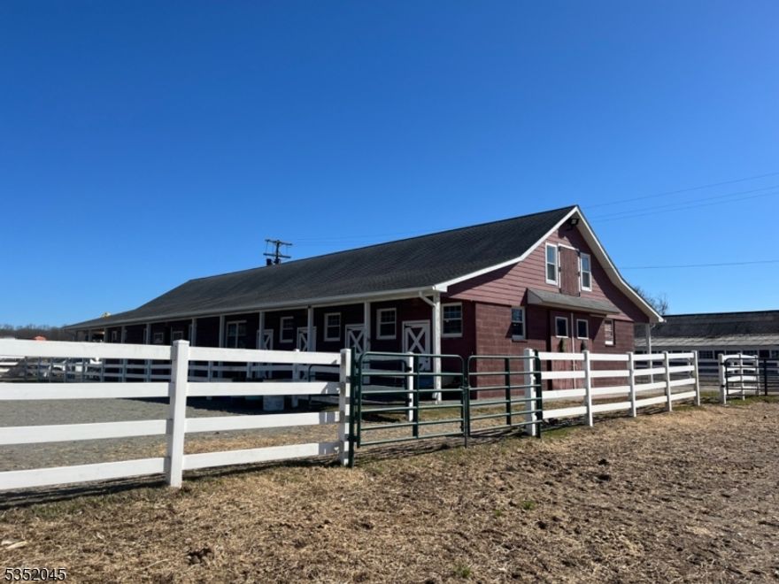 An AMAZING OPPORTUNITY!  Gorgeous 8 stall horse barn with tack room, outdoor riding ring and fenced turnout fields.  Part of a picturesque setting, you'll love this spot.  Shared bathroom and ample parking.  Available November 1, 2025.