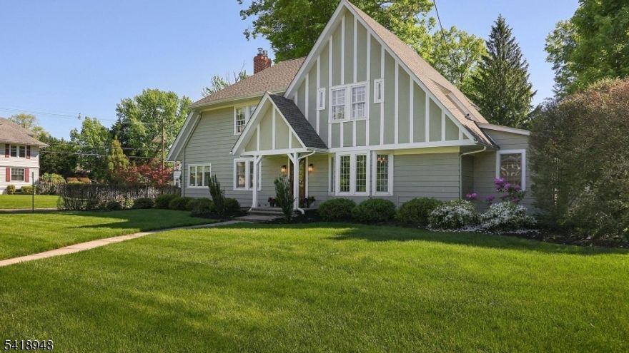 Location, location, location! Absolutely stunning and spacious Tudor style Colonial located mere steps from downtown Westfield. This gorgeous home offers all the amenities one could wish for! A welcoming grand foyer opens to the elegant Living & Dining Rooms. The Living Room features gas fireplace with white brick surround and is ideal for entertaining! The adjoining den is perfect for reading, lounging, a playroom or office. The banquet sized Dining Room is wonderful for holiday gatherings and features French Doors to the large eat in Kitchen with ceiling height shaker cabinets, stainless steel appliances, oversized island, modern light fixtures, huge eating area and walk in pantry. Adjacent to the kitchen, the mudroom, outside entrance & powder room are also conveniently located. The 2nd level hosts the primary Bedroom and bath, plus 3 generous sized bedrooms, a hall bath and linen closet. And the 3rd level features an office and plentiful storage.  The basement offers endless possibilities to be finished! The flat corner property is splendid, and the stone patio is ideal for outdoor dining, relaxing and entertaining. Other notable features include: hardwood floors throughout (except under carpet in primary and office), crown and base molding throughout, wooden blinds, EV charger, underground sprinkler and much more. Walk to town and enjoy everything Westfield offers, including our award-winning schools!