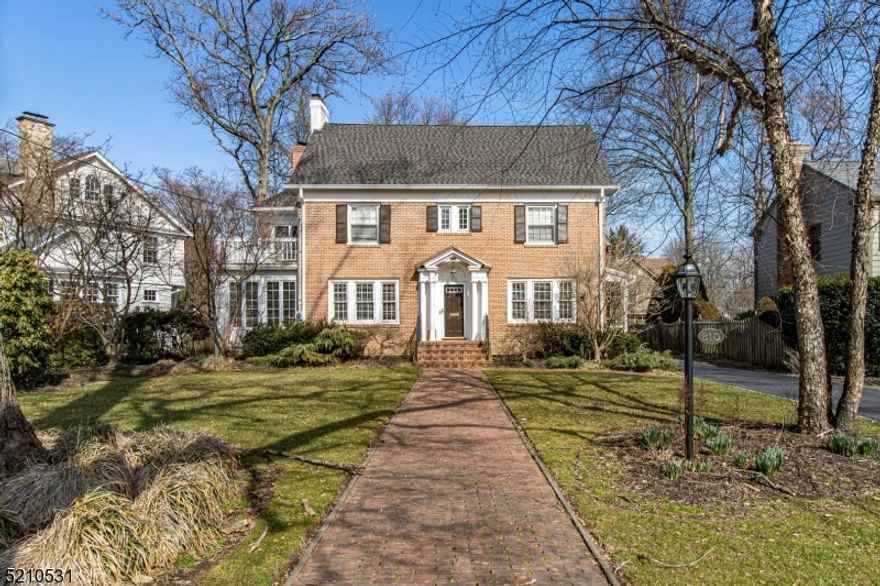 Welcome Home to this Gorgeous Brick Center Hall Colonial on a quiet tree lined street in the heart of The Gardens! This classic 5 bedroom, 4.1 bathroom exudes timeless charm with a modern flow and spacious floor plan.  A welcoming foyer is flanked by formal dining room, an inviting living room with wood FP, and a cozy library/den with ample amounts of light for reading and relaxing. Kitchen boasts the perfect mix of prep space and storage, massive center island and opens to a large family room with gorgeous built-ins and stunning stone gas FP. The 2nd floor boasts 4 spacious bedrooms and 3 full baths, including primary bedroom with a custom master bath and WIC & sep cedar closet. The 3rd floor is the perfect sanctuary with a exercise room, office, bedroom, and full bath. A new deck, generator, AC unit, roof, gutters, hot tub and lighting are a few of the many recent updates made to this fabulous home.  Don't miss this Gem in one of The premier neighborhoods on the Northside of town close to everything Westfield has to offer!