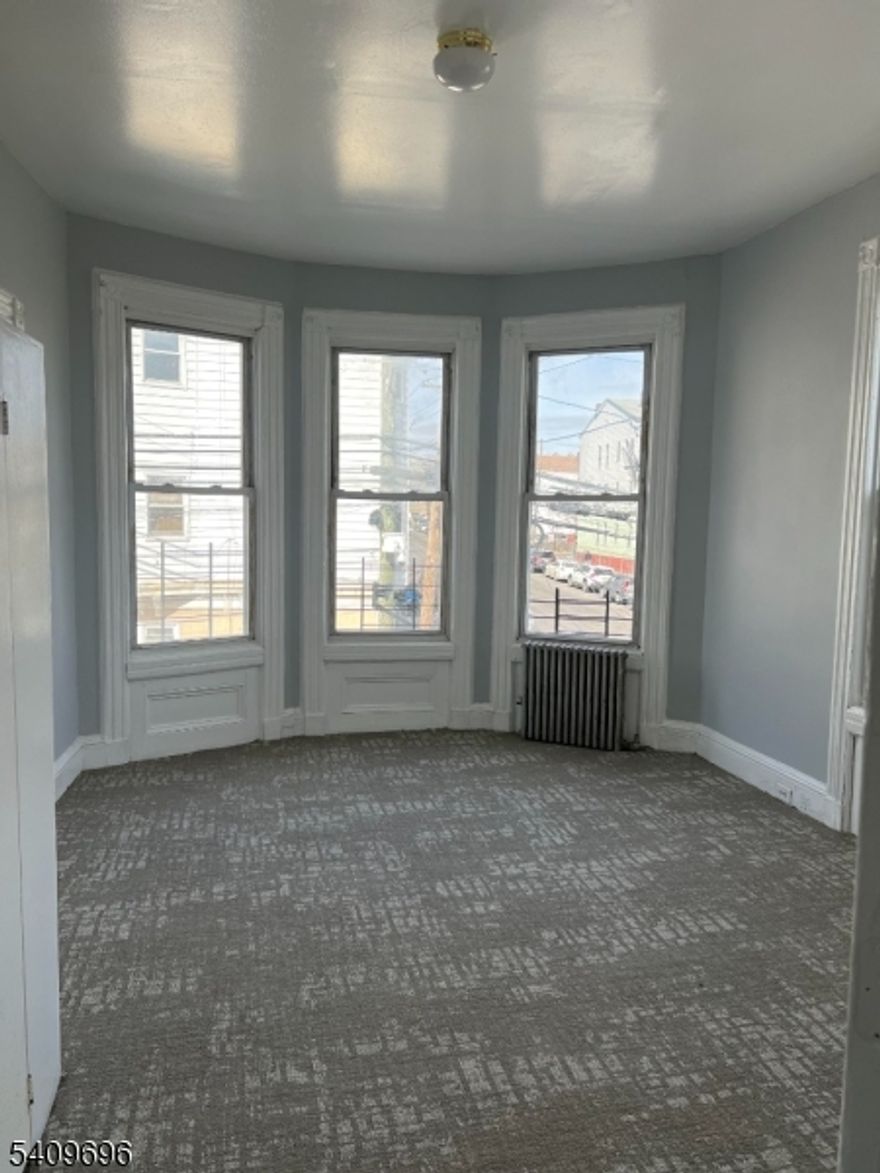 Spacious second floor apartment, Livingroom, 3 bedroom and 1 bath. Eat in Kitchen w upgrades. Freshly painted with new carpet and New vinyl floors