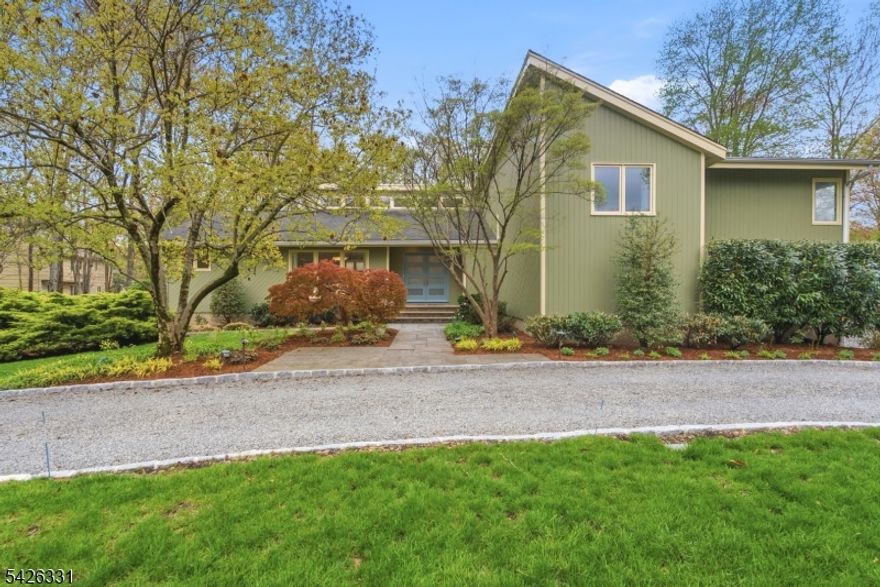 Welcome to this beautiful 4-bedroom, 3.5-bathroom contemporary home, ideally located on a quiet cul-de-sac in Morris Township. The home offers an open layout with abundant natural light, designed for both everyday living and entertaining. The living, dining, and kitchen areas connect seamlessly, creating a comfortable and functional setup. The kitchen features a large center island and radiant heated floors, making it a natural gathering space. All main living areas on the first floor lead directly to the back deck.The primary suite serves as a private retreat, complete with two walk-in closets, a dressing area, and a bathroom with radiant heated floors. Three additional bedrooms provide ample space, along with a family room and dedicated home office. Custom cabinetry and closets can be found throughout the bedrooms and bathrooms.The finished basement offers additional living space and includes a custom 800 bottle wine cellar. An oversized two-car garage adds convenience and extra storage. Outside you will find a huge back deck with beautiful landscaping and native plant garden. Set in a flat neighborhood, this home offers a great setting for outdoor use, all just minutes from downtown Morristown's shops, restaurants, and NJ Transit.