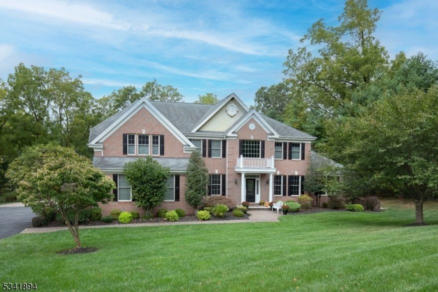 Highly sought-after Governor Estates Located on the EAST side of Mendham - Min from Downtown Morristown! Sun-filled, open-floor-plan Custom Estate Home is ideal for year-round entertaining, offering pristine upgrades, expert remodels & luxury finishes throughout. Situated on over 2 private acres at end of cul de sac, this stunning home features coffered tray ceilings, custom moldings, wainscoting, recessed lighting, double-hung Anderson windows & Hardwood Floor throughout. Gourmet eat-in kitchen boasts professional Viking appliances, a 10' center island & sunlit breakfast area w patio access- as well as butler's pantry & mudroom entrance from 3 car garage. Two story FR w gas fireplace & custom cabinetry seamlessly connects to the Kitchen. Formal foyer opens to DR, LR & Conservatory w a shared gas fireplace & French doors. Home office offers privacy with French doors. Primary Suite features a sitting room, en-suite full bath, 2 large walk-in closets with California Closet. 2nd floor offers 3 more Bedrooms & Fabulous Laundry Room addition w custom cabinetry, recessed lighting, new LG washer/dryer. Full finished 2,000 sq. ft. LL includes a full bath, gym, rec room, recessed lighting & ample storage. High ceilings throughout, including the LL, enhance the home's spacious and luxurious feel. The expansive paver patio includes a custom gas fire pit, Stone fireplace, Hot Tub & private 2 acre lot. Generac Generator, Central vac. Alarm. Sprinkler system. Excellent Schools! A MUST SEE!