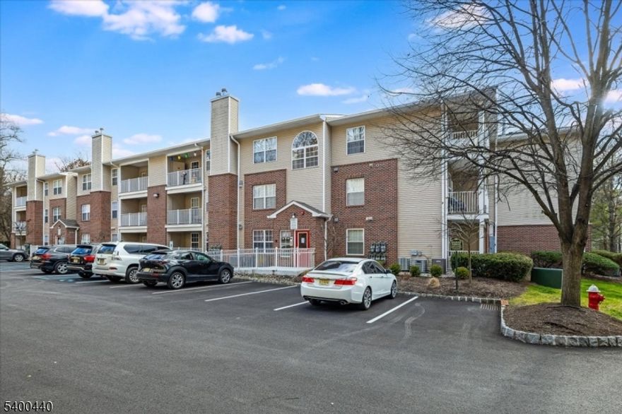 This Desirable First Floor unit has been Beautifully Remodeled! The Custom Kitchen with all new Cabinetry, Quartz Countertops, Stainless Steel Appliances were just installed a few years ago! Remainder of the units has also been Renovated, Including: Hardwood flooring throughout, moldings, barn door off kitchen into large laundry room, the 2 full bathrooms, and all the finishes display true pride in ownership. Both Bedrooms have hardwood floors, & boast Walk in Closets. Open Concept Living, Dining Rooms, & Kitchen w/ breakfast bar. Living Room offers tons of natural light, Hardwood Floors, Recessed Lighting, & glass door to Private Outdoor Patio with Storage area. In unit Laundry Room add to the Comfort and Convenience of this sought after Condo Unit. No stairs from Parking Lot into Unit!  One Parking Spot included with Tons of Additional Spots available. Clubhouse with Gym & Event Room only steps away. Walk to Shopping & Public Transportation to NYC. NTN CREDIT / BACKGROUND CHECK, PROFF OF INCOME ARE REQUIRED. NO PETS!! DO NOT MISS!!