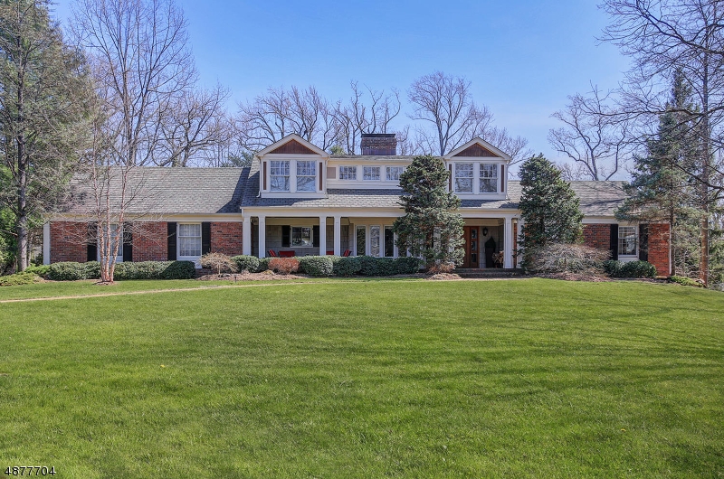 Sprawling Colonial on private cul-de-sac offering 3 fabulous floors of living space. 1st floor features a welcoming open front porch, sunken LR w/wood burning fireplace, FDR w/parquet floors w/pocket doors to center island EIK boasting granite countertops, SS appliances and separate dining area. 3 bedrooms & 2 full baths complete 1st level.  2nd level features expansive MBR suite w/sleeping area, sitting area, dressing room, luxurious bath & terrace overlooking backyard. A laundry area completes 2nd floor. LL expansive family room w/FP & access to backyard, addl bedroom/exercise room, office, kitchenette, laundry room & full bath.Situated on 3/4 of an acre, stunning grounds incl a patio, in-ground heated pool w/hot tub and 2 car attached garage.  Loaded with upgrades throughout, this home is truly special!