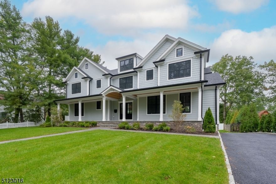 Experience luxury at its finest with this custom home loaded with high end features throughout. Step on the bluestone covered porch and enter through the double doors & you are greeted with herringbone laid white oak floors, oversized windows and gleaming hardwood floors.  With an open concept floor plan that features chef's kitchen that is open to family room w coffered ceiings, a 42 inch gas fireplace & double slider doors that lead out to the professionally landscaped backyard. Kitchen is top of the line with Wolf/Sub zero appliances, custom cabintry, wood center island with built in microwave & wine fridge, and quartz countertops. First floor holds gracious sized bedroom with full bath, large dining room with molding throughout, study with custom built ins, and powder room.  2nd floor holds four spacious bedrooms - all en suite with custom built ins and all walk in closets. Primary bedroom is stunning with wood tres ceiling,  an oversized custom closet, a primary bath with water closet, double vanity with quartz countertops, soaking tub & an oversized shower with glass enclosure .  Lower level includes full bath and tiled wood -like gray flooring & mudroom with builts ins leading out to the 2 car garage. *For Comp purposes only *