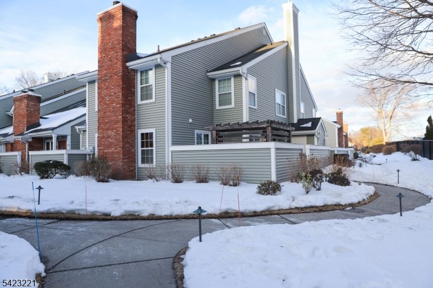 Welcome to The Pointe at Galloping Hill, where low-maintenance living and commuter convenience come together. This desirable corner residence is one of the largest three-bedroom models in the community, offering a bright, open layout and flexible living spaces.A private patio extends your living area outdoors, perfect for relaxing or entertaining. Inside, the main level features a light-filled living area with energy-efficient windows and a wood-burning fireplace, along with a powder room and in-unit laundry. The kitchen offers stainless steel appliances, granite countertops, and flows into a versatile adjoining space ideal for a home office, dining area, or playroom.Upstairs, three generously sized bedrooms include a primary suite with its own private bath and shower. Additional highlights include updated interior finishes, high-efficiency heating, cooling, and water heating systems, and a smart, app-controlled whole-house water filtration system.The HOA covers exterior "walls-out  maintenance, including roof and building exterior (roof replaced approximately 1.5 years ago), outdoor insurance, and snow removal. Residents enjoy a gated community with 24-hour security, pool, clubhouse, and ample parking. NJ Transit Express buses 114 and 117 stop just outside, with access to bus 65 along Route 22. Union Train Station and major highways are minutes away, and Union Township school buses provide in-community pickup.