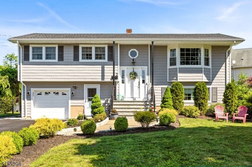 Don't miss this terrific opportunity to buy a completely updated, four bedroom three full bathroom bi- level on a picture perfect,  level fenced in lot. Open floor plan, hardwood floors and beautiful landscaping make this a can't miss home.  Recent Updates include new kitchen and bathrooms, new roof, windows, siding, boiler and central air and underground sprinklers. Nothing to do except move into this picture perfect home! Don't miss this turn key property. This one will not last!